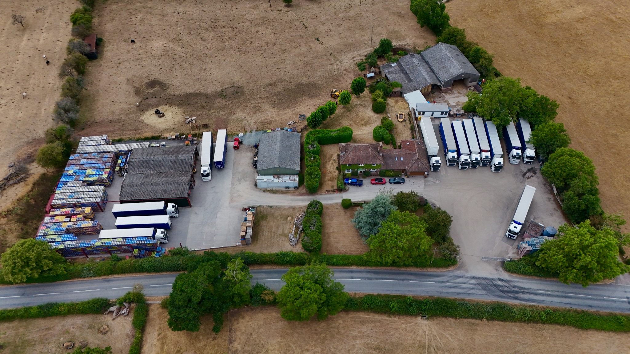 High aerial photograph of Berrends Farm surrounded by fields and woodland