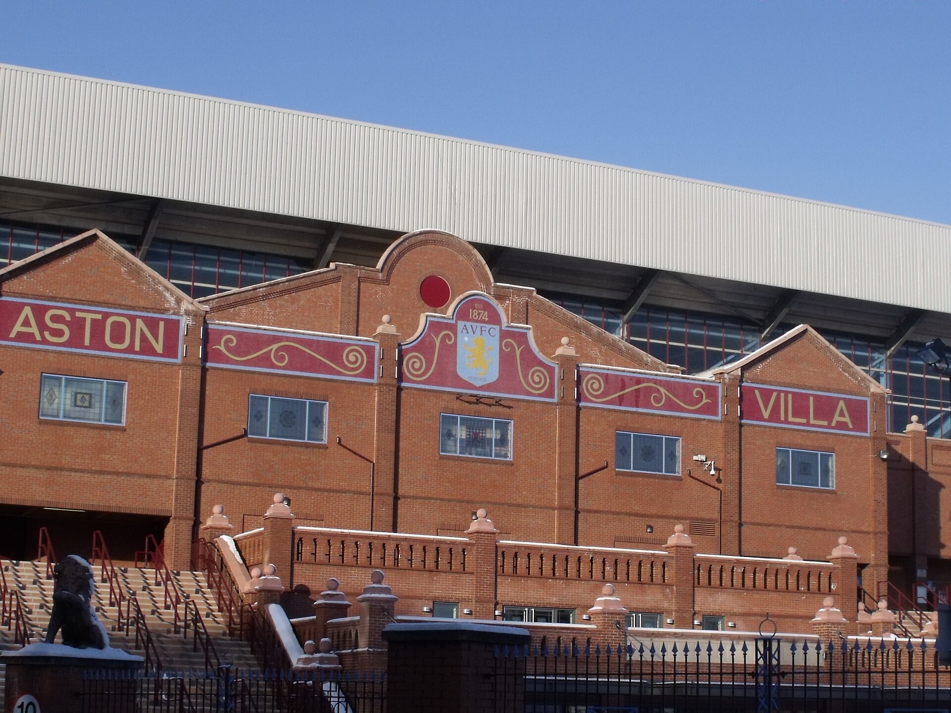 The historic brick facade of the Holte End at Villa Park